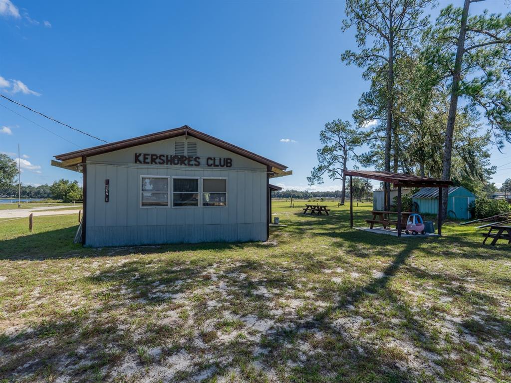 24797 Northeast 135th Street Salt Springs, FL 32134 - Photo 50 of 61 a view of a house with a yard and sitting area