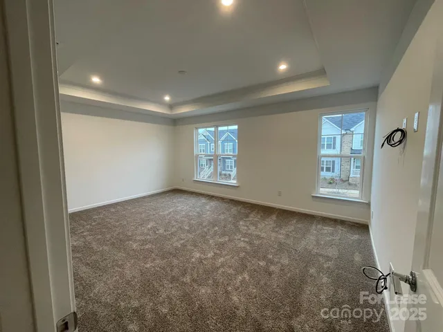 a view of an empty room and a window