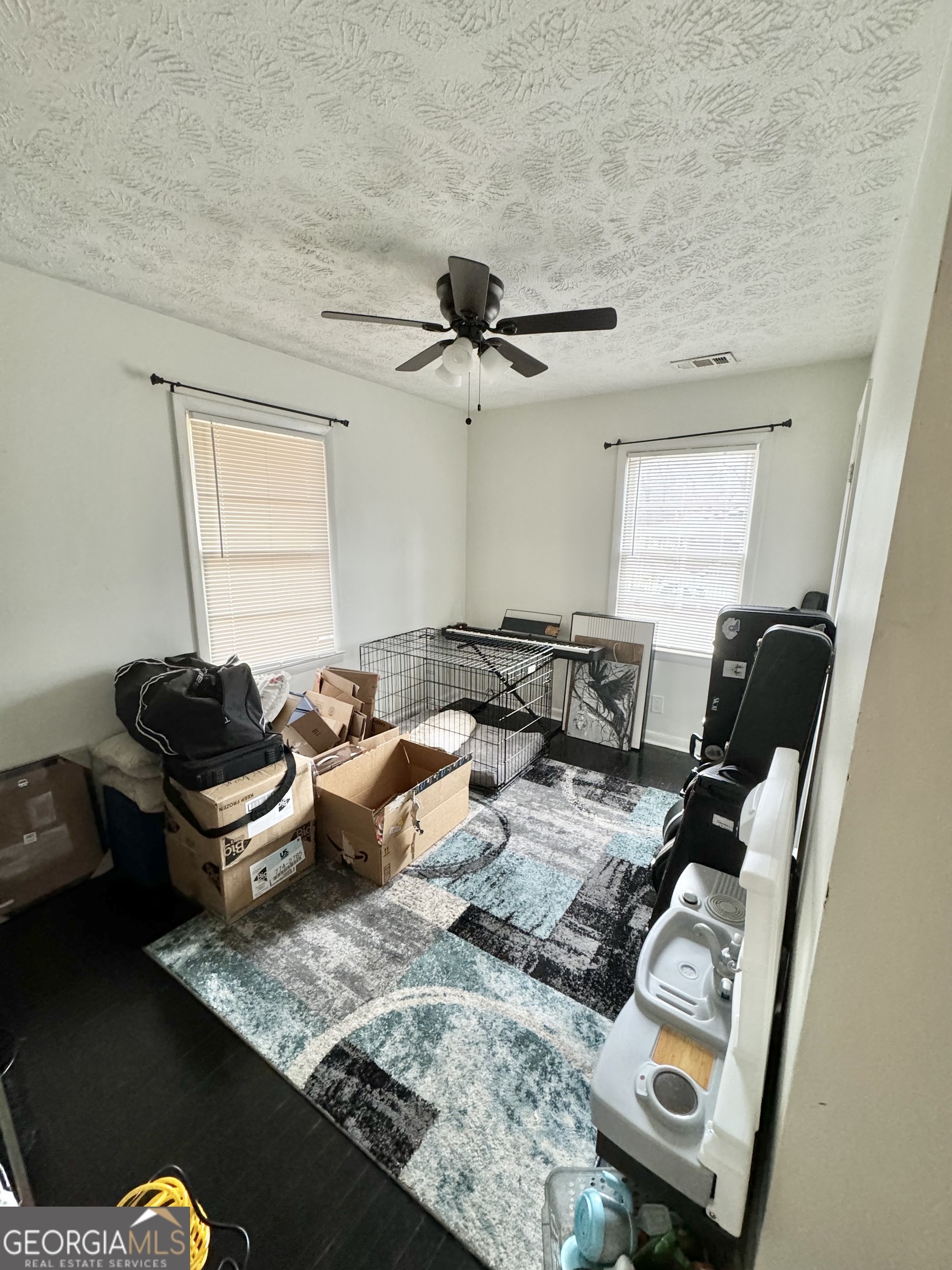 2009 Euclid Street Statham, GA 30666 - Photo 11 of 14 a living room with furniture and a window