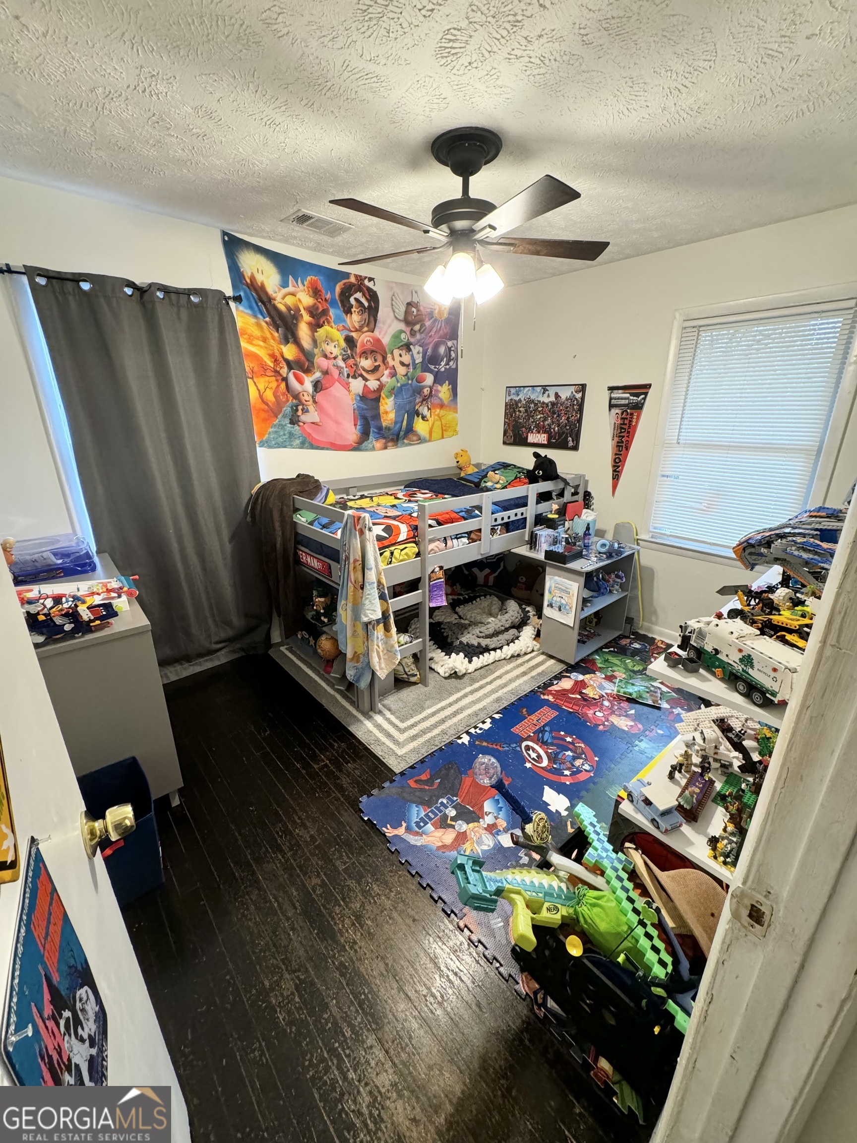 2009 Euclid Street Statham, GA 30666 - Photo 14 of 14 a bedroom with furniture and a flat screen tv