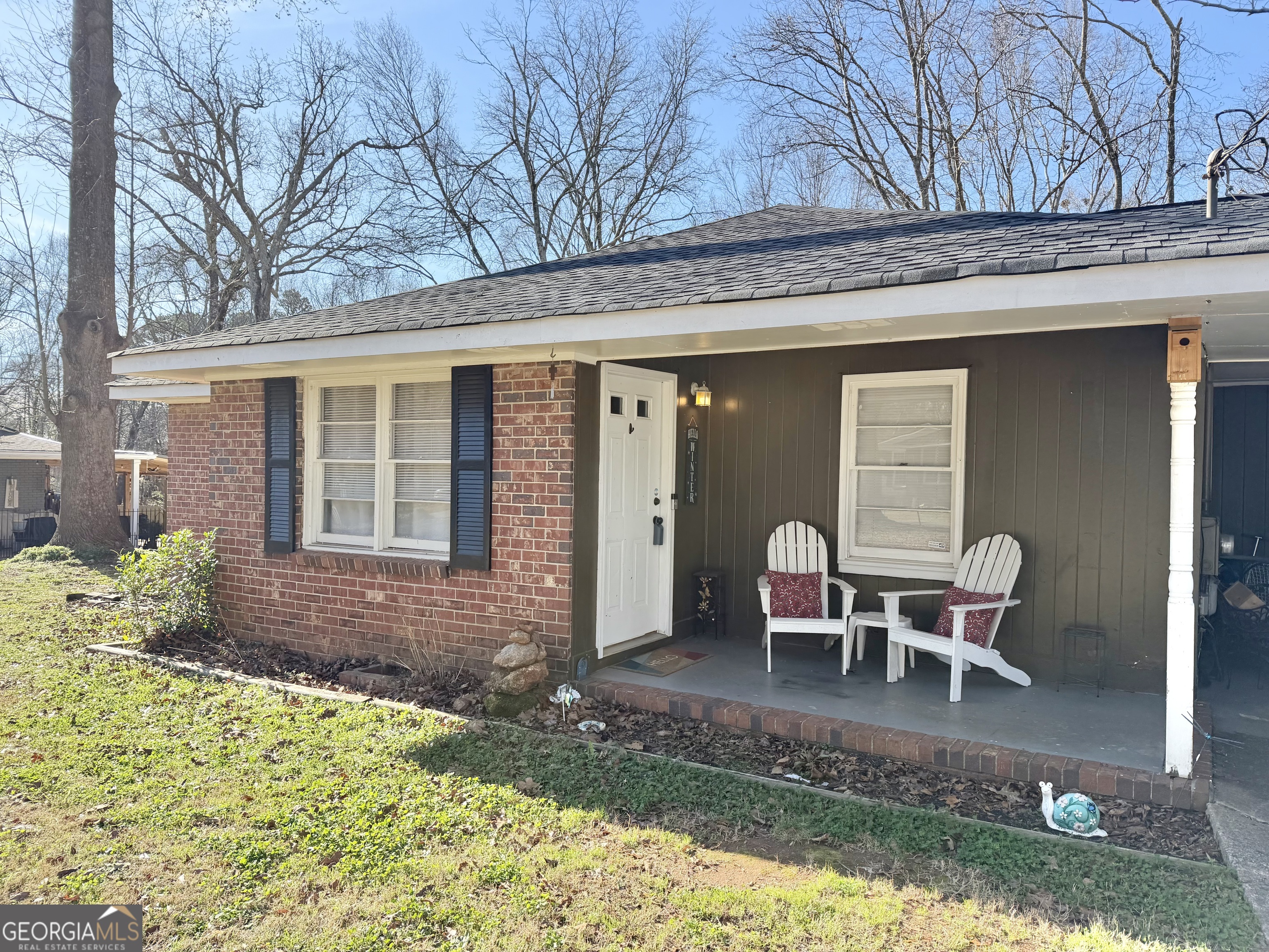 2009 Euclid Street Statham, GA 30666 - Photo 2 of 14 a backyard of a house with a fountain table and chairs