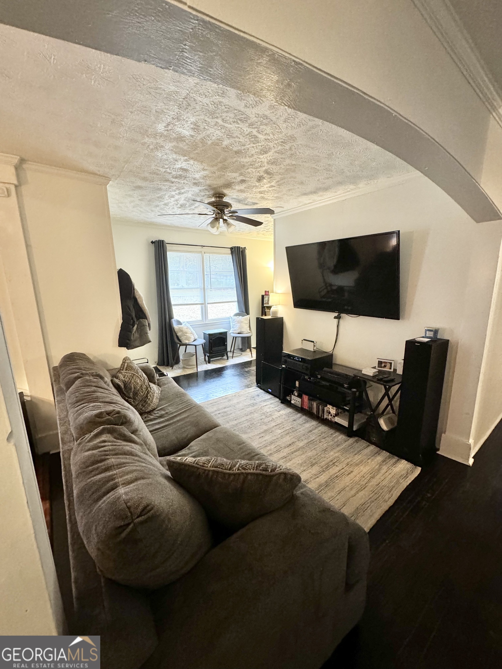 2009 Euclid Street Statham, GA 30666 - Photo 6 of 14 a living room with furniture and a flat screen tv