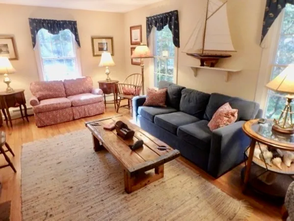a living room with furniture and a table