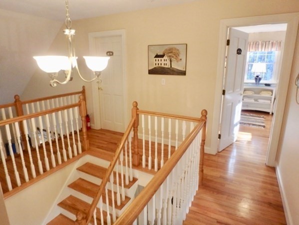 100 Connie's Way Tisbury, MA 02568 - Photo 17 of 34 a view of a hallway with wooden floor and staircase