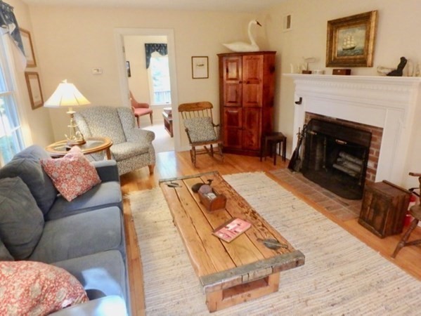 100 Connie's Way Tisbury, MA 02568 - Photo 2 of 34 a living room with furniture and a fireplace