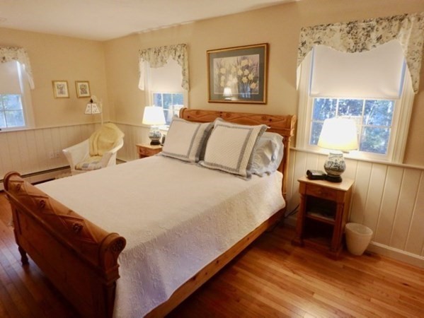 100 Connie's Way Tisbury, MA 02568 - Photo 21 of 34 a large bed sitting in a bedroom next to a window
