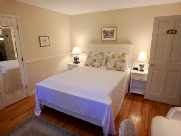 100 Connie's Way Tisbury, MA 02568 - Photo 24 of 34 a bedroom with a bed and a dresser