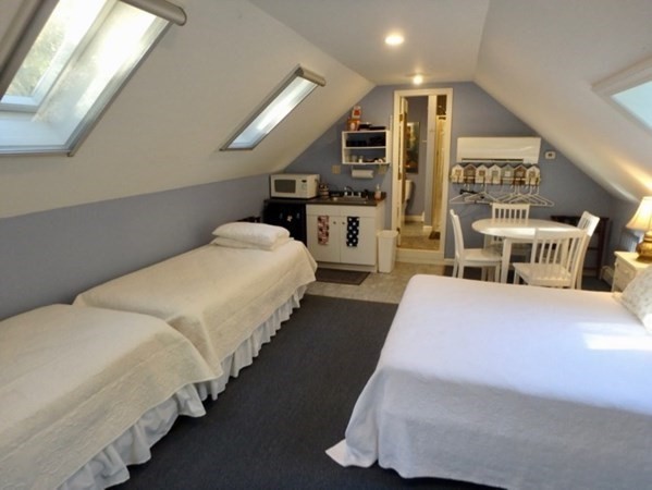 100 Connie's Way Tisbury, MA 02568 - Photo 25 of 34 a bedroom with bed and wooden floor