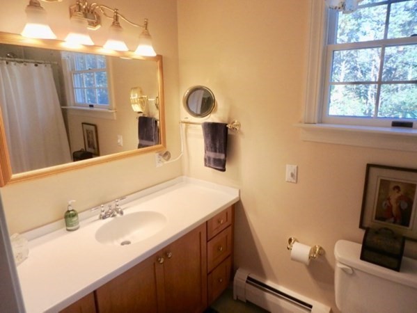 100 Connie's Way Tisbury, MA 02568 - Photo 28 of 34 a bathroom with a sink and a mirror