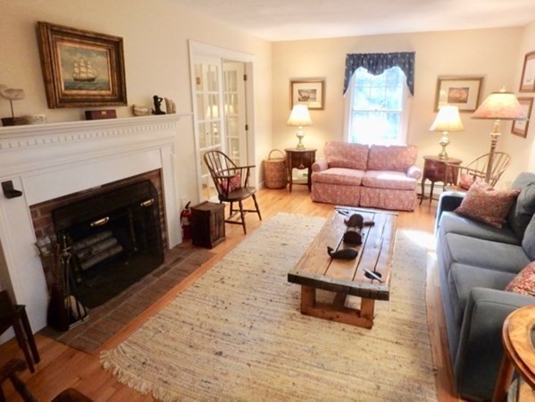 100 Connie's Way Tisbury, MA 02568 - Photo 3 of 34 a living room with furniture and a fireplace