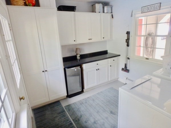 100 Connie's Way Tisbury, MA 02568 - Photo 32 of 34 a kitchen with white cabinets and sink