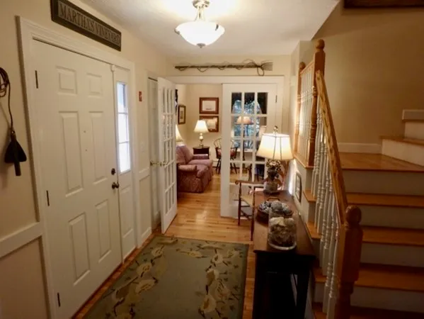 a view of a livingroom with furniture and a window