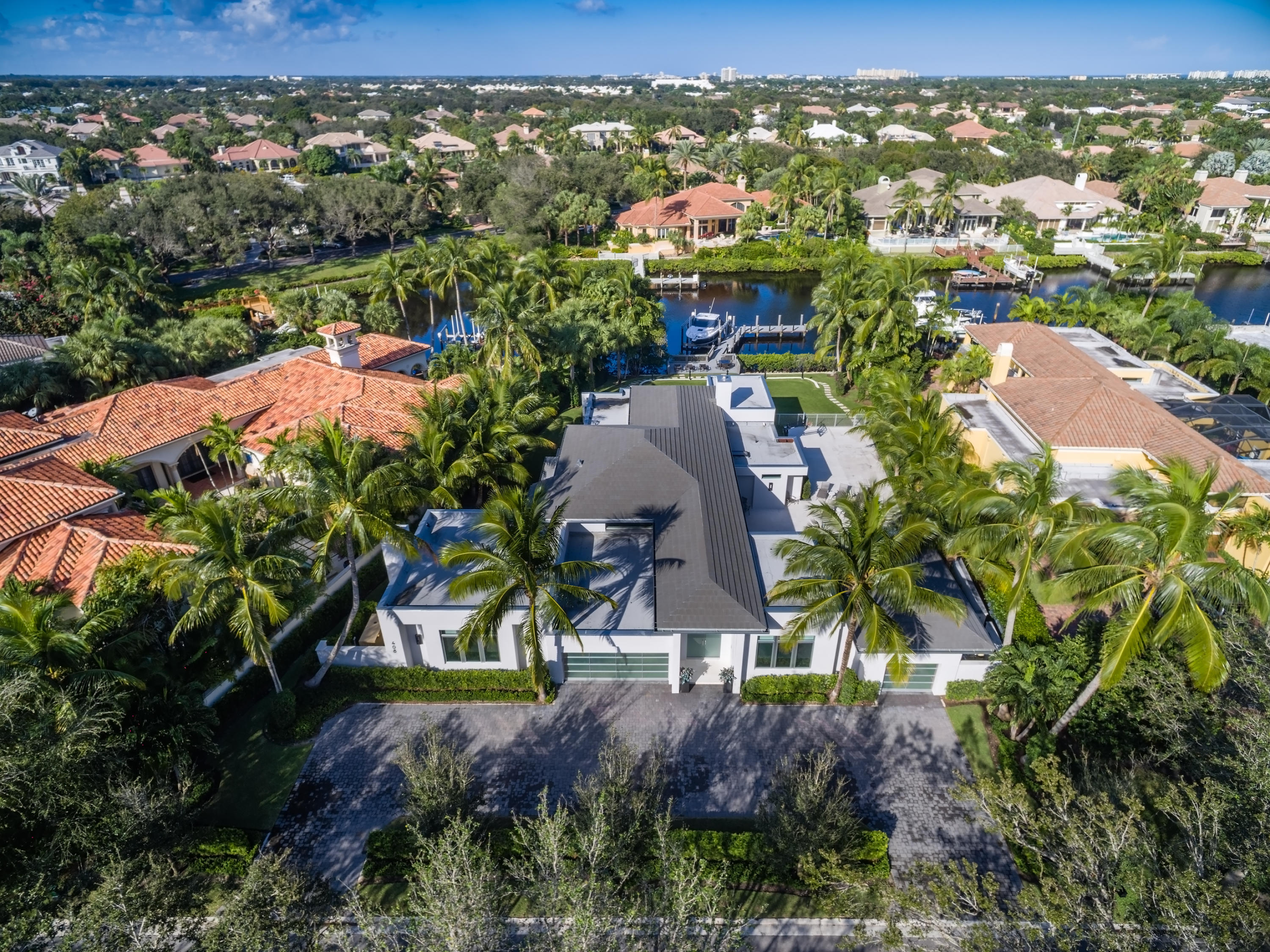 an aerial view of residential houses with outdoor space and street view