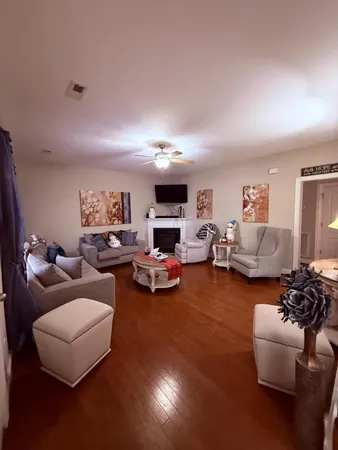 a living room with furniture and a fireplace