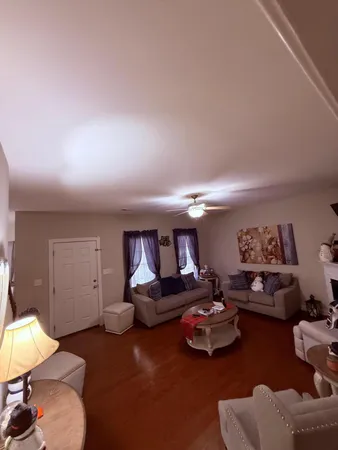 a room with furniture and a lamp