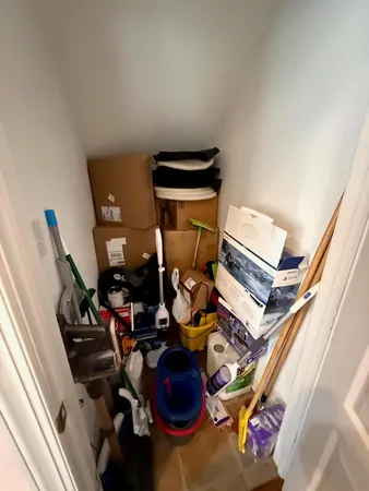 a living room with furniture and chandelier