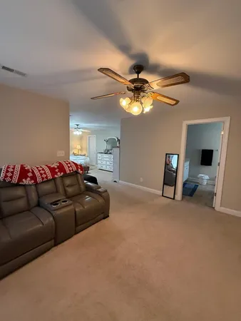 a room with a bed and a flat screen tv