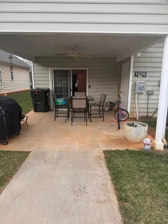 a view of a backyard with furniture