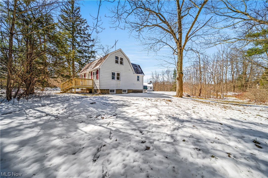 8790 Sumner Road Chardon, OH 44024 - Photo 33 of 46 Snow covered property featuring a deck