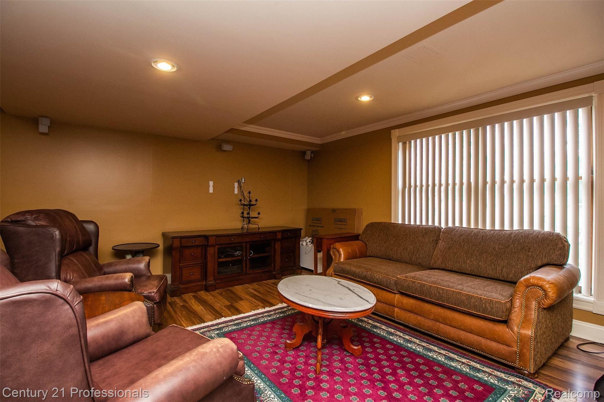 69401 Eldred Road Romeo, MI 48065 - Photo 45 of 65 TV Rm area in Walkout basement. Surround sound T/O