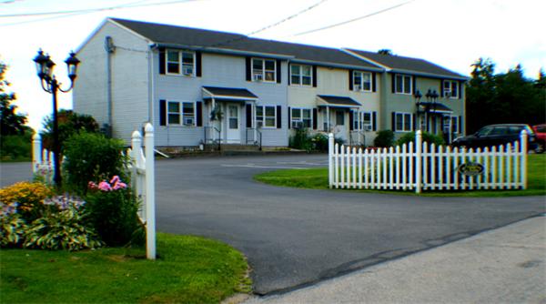 1 Fawn Ridge, Unit 1 Brookfield, CT 06804 - Photo 1 of 23 a front view of a house with a garden and deck