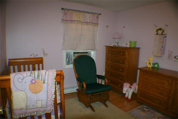 1 Fawn Ridge, Unit 1 Brookfield, CT 06804 - Photo 20 of 23 a living room with furniture and a chair