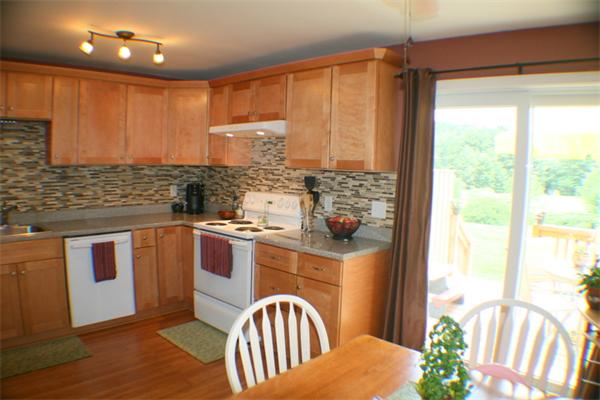 1 Fawn Ridge, Unit 1 Brookfield, CT 06804 - Photo 9 of 23 a kitchen with stainless steel appliances granite countertop a stove a sink and a refrigerator