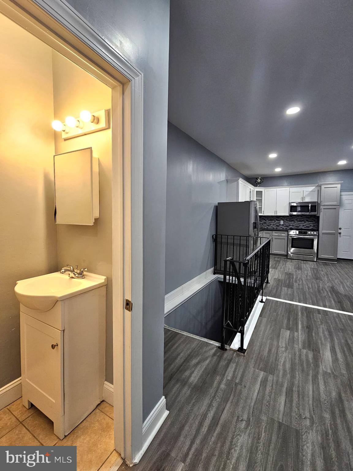 827 South 56th Street Philadelphia, PA 19143 - Photo 13 of 36 a view of a hallway with wooden floor and furniture