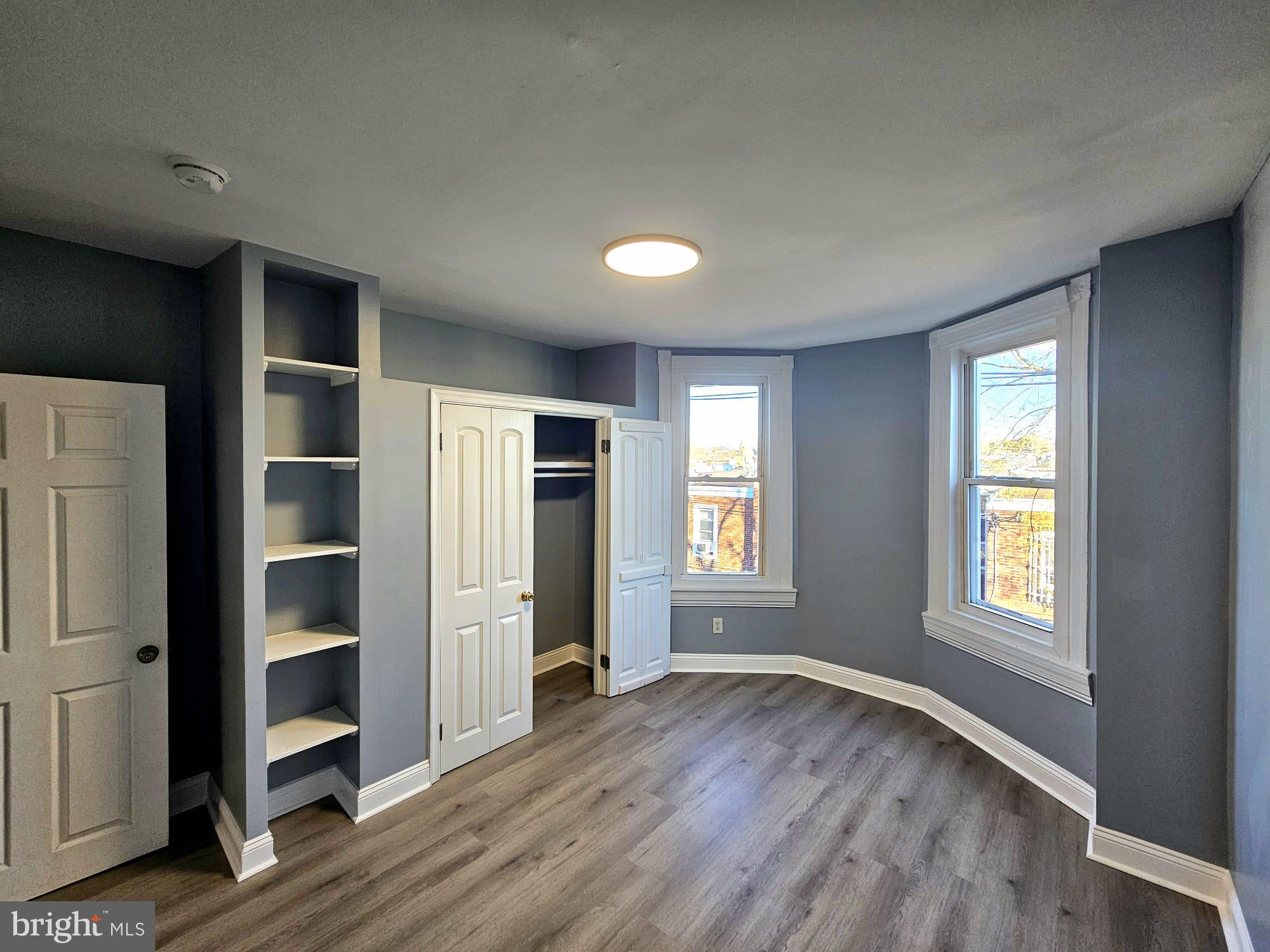 827 South 56th Street Philadelphia, PA 19143 - Photo 16 of 36 an empty room with windows and closet