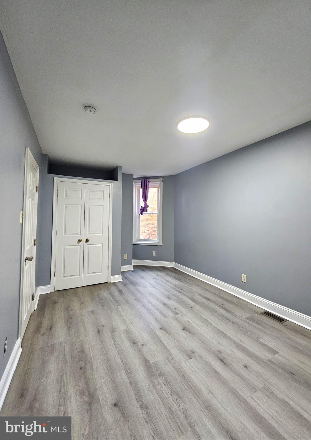827 South 56th Street Philadelphia, PA 19143 - Photo 18 of 36 a view of empty room with wooden floor and fan