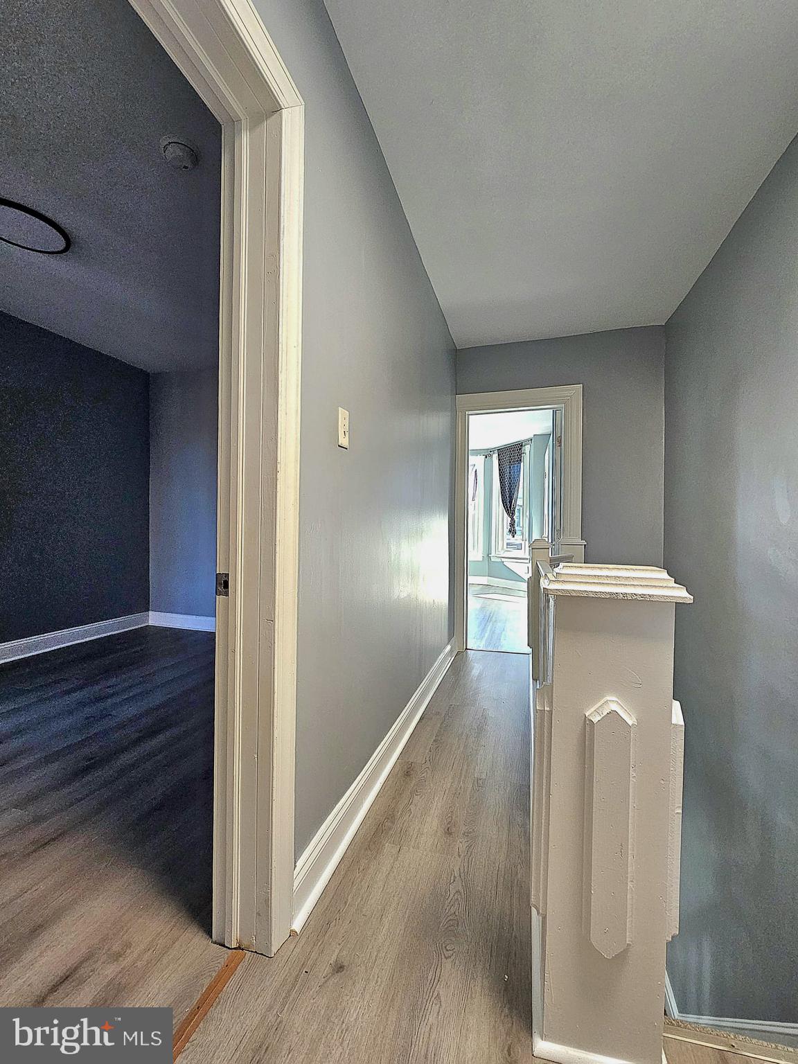 827 South 56th Street Philadelphia, PA 19143 - Photo 25 of 36 a view of a hallway to an empty room and wooden floor