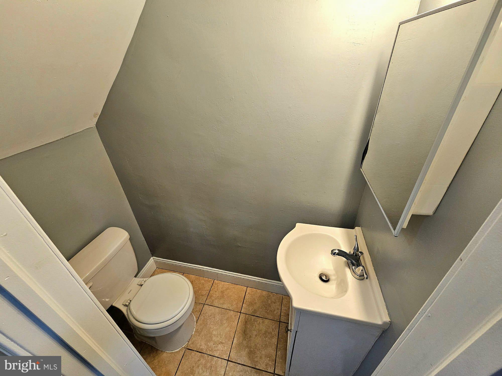 827 South 56th Street Philadelphia, PA 19143 - Photo 27 of 36 a bathroom with a toilet and a sink