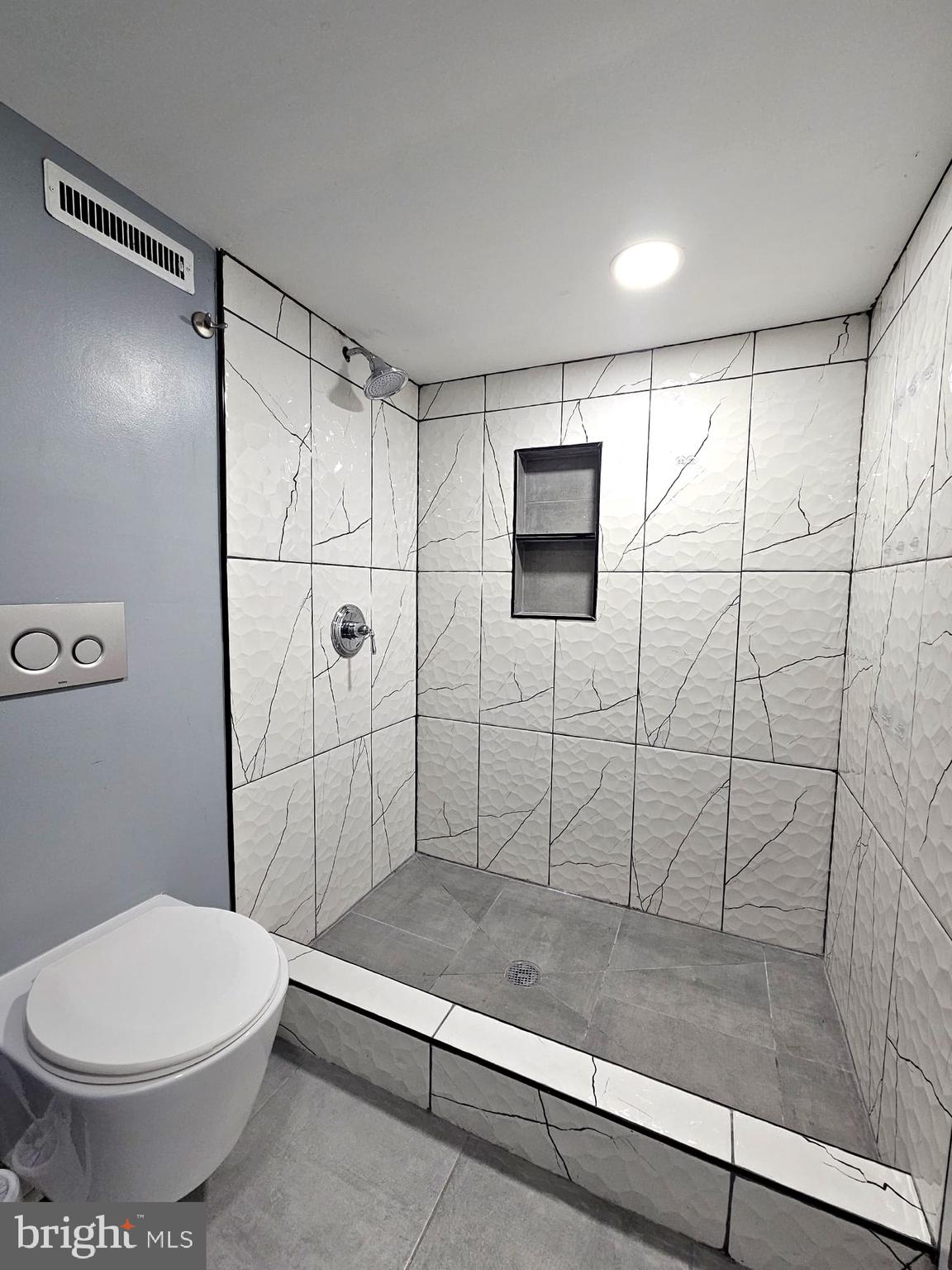 827 South 56th Street Philadelphia, PA 19143 - Photo 30 of 36 a bathroom with a toilet and a shower