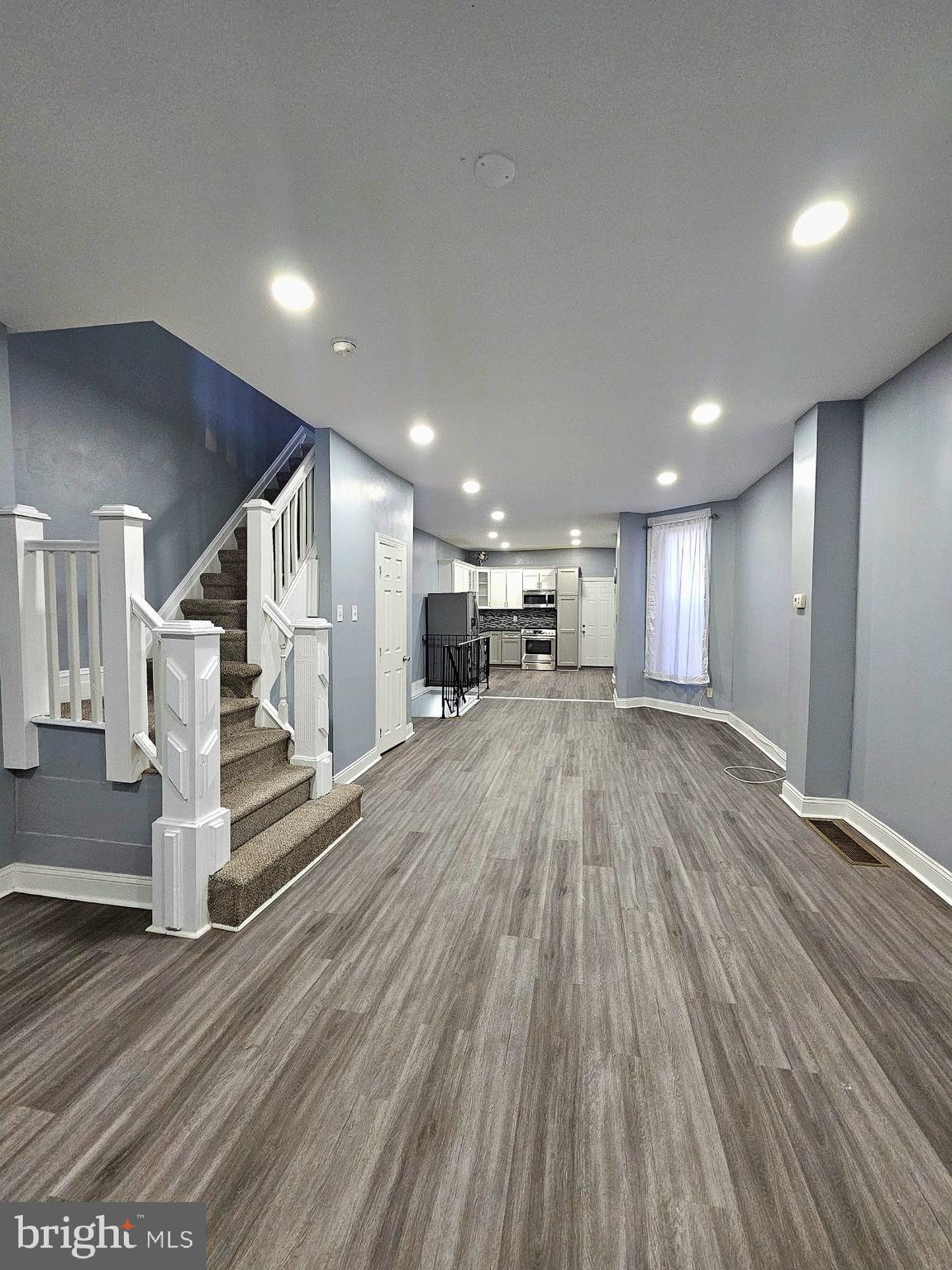 827 South 56th Street Philadelphia, PA 19143 - Photo 4 of 36 a view of wooden floor and windows in a room
