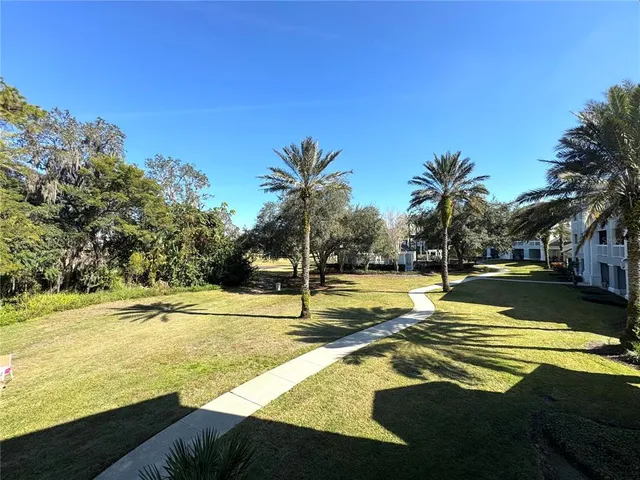 a view of a swimming pool with an outdoor space and seating area