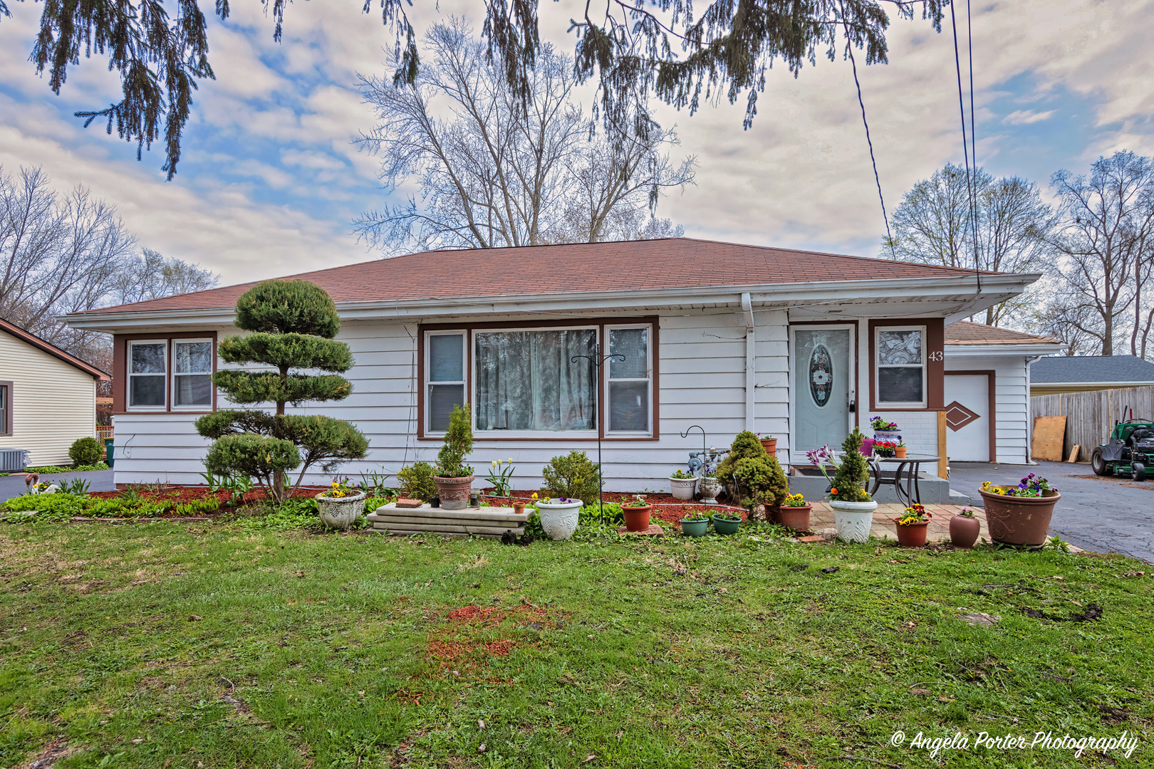 a front view of house with yard and seating area