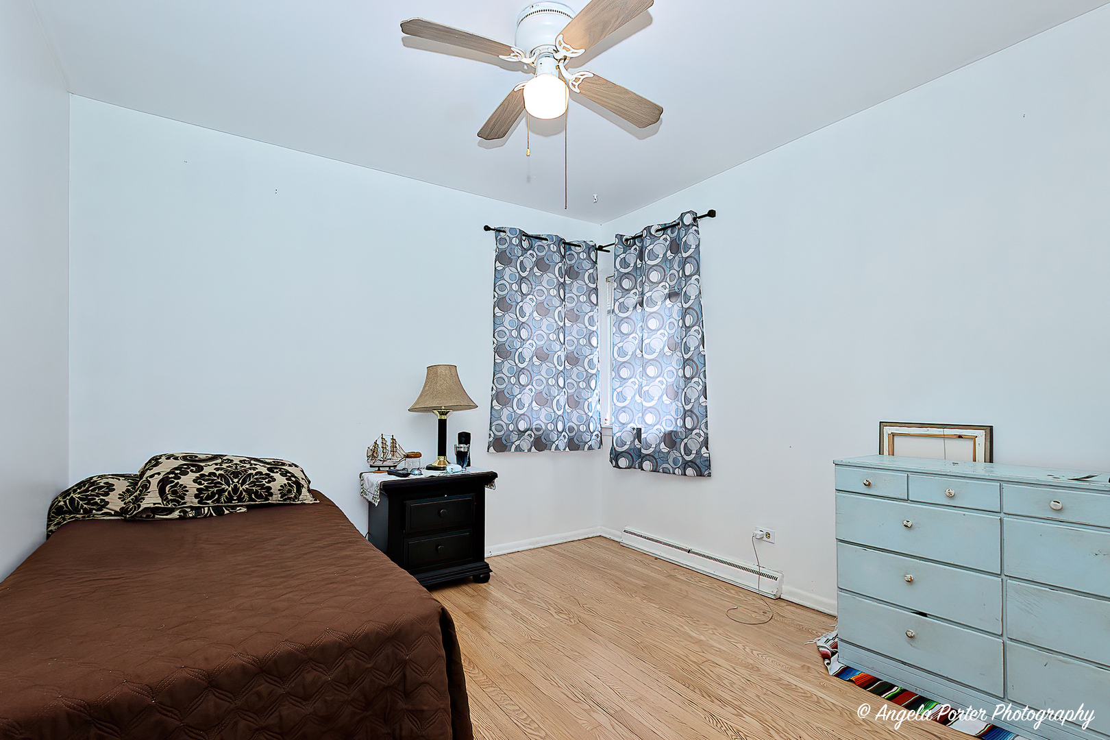 43 Lippincott Road Fox Lake, IL 60020 - Photo 7 of 31 a bedroom with a bed and a chandelier fan