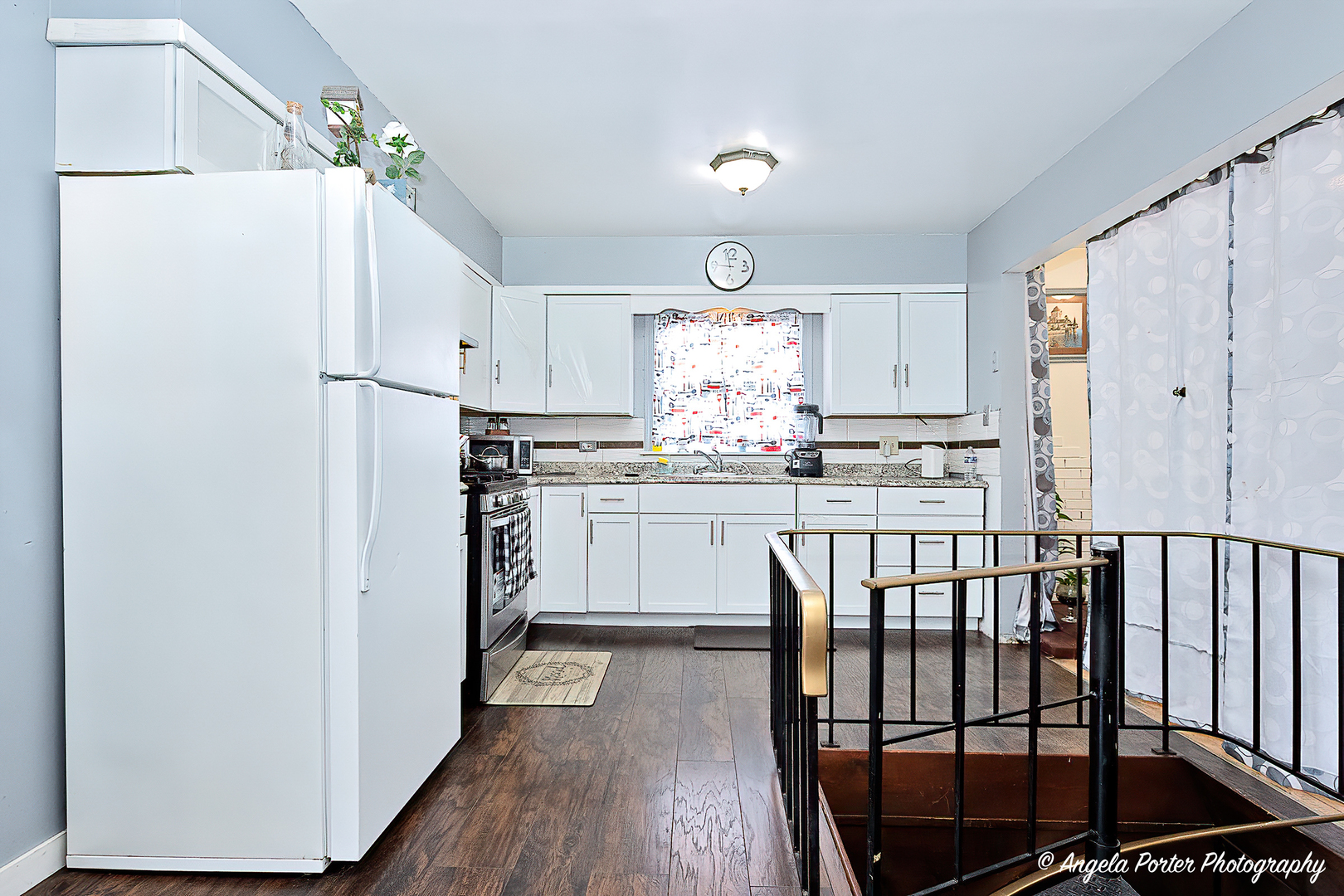 43 Lippincott Road Fox Lake, IL 60020 - Photo 9 of 31 a kitchen with kitchen island white cabinets and refrigerator