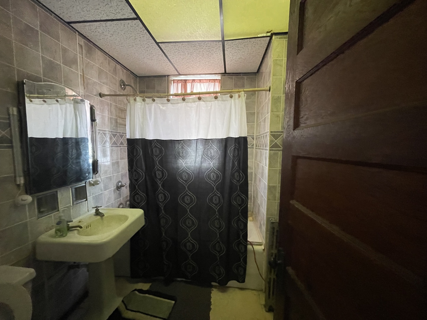 656 North Drake Avenue Chicago, IL 60624 - Photo 17 of 33 a bathroom with a sink toilet and shower