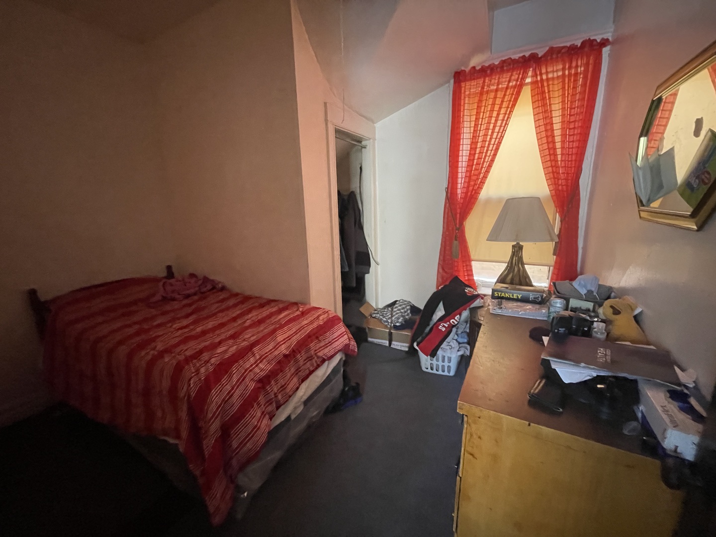 656 North Drake Avenue Chicago, IL 60624 - Photo 22 of 33 a bed sitting in a bedroom next to a window