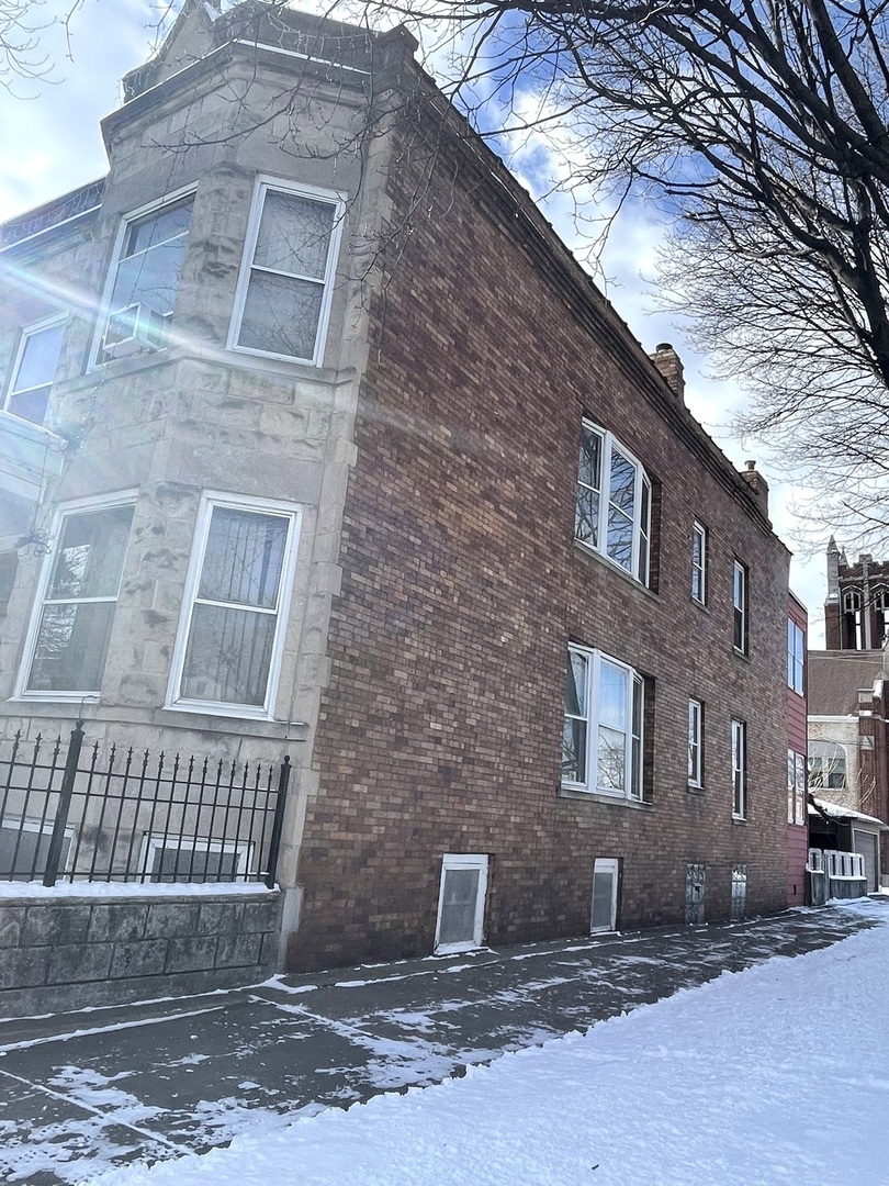656 North Drake Avenue Chicago, IL 60624 - Photo 3 of 33 a front view of a house with a yard