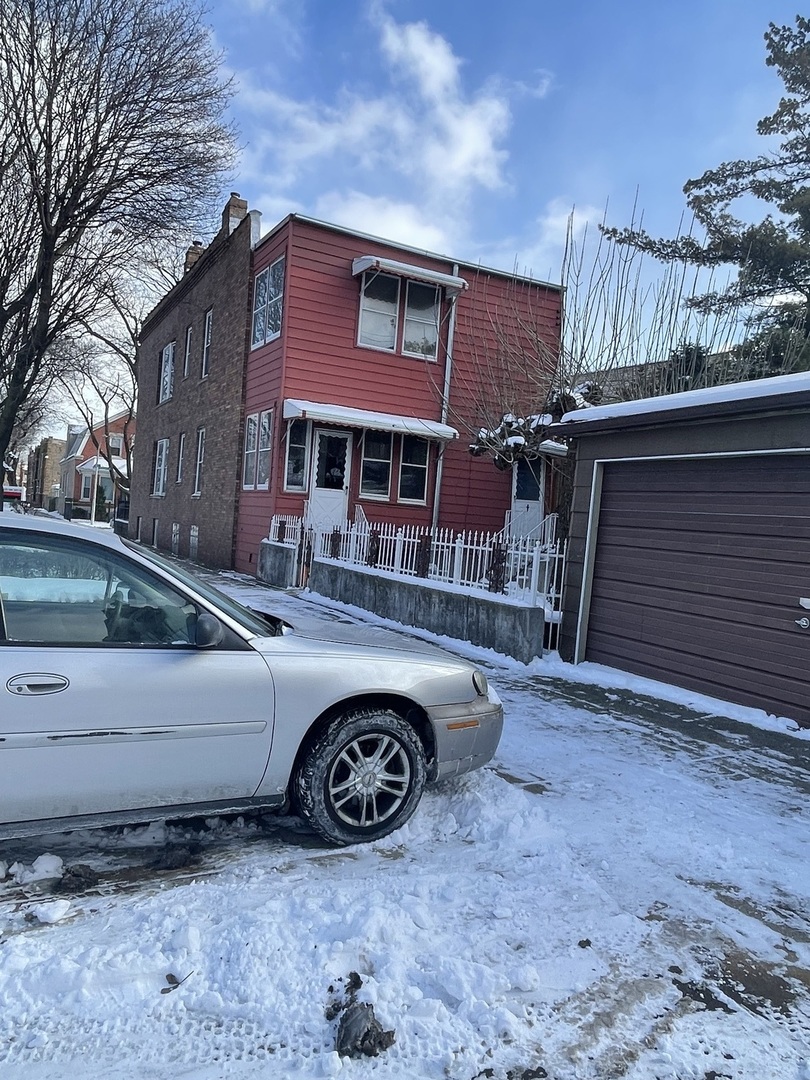 656 North Drake Avenue Chicago, IL 60624 - Photo 31 of 33 a front view of a house with parking space