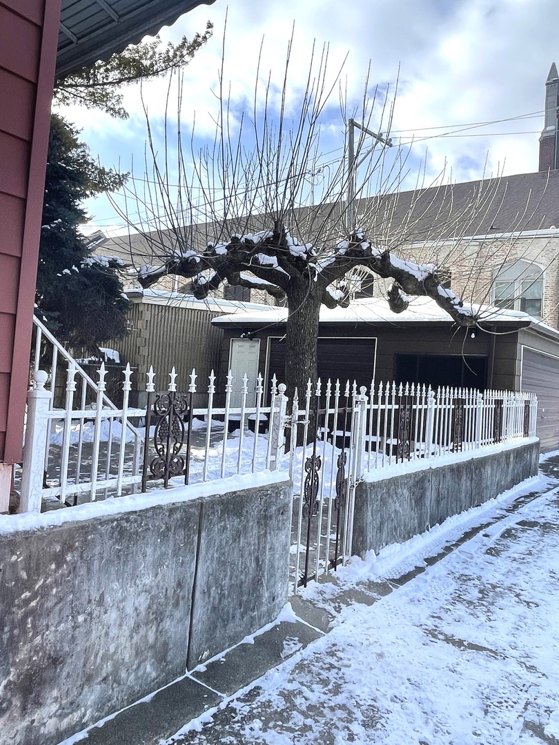 656 North Drake Avenue Chicago, IL 60624 - Photo 33 of 33 a view of a house with a wooden deck