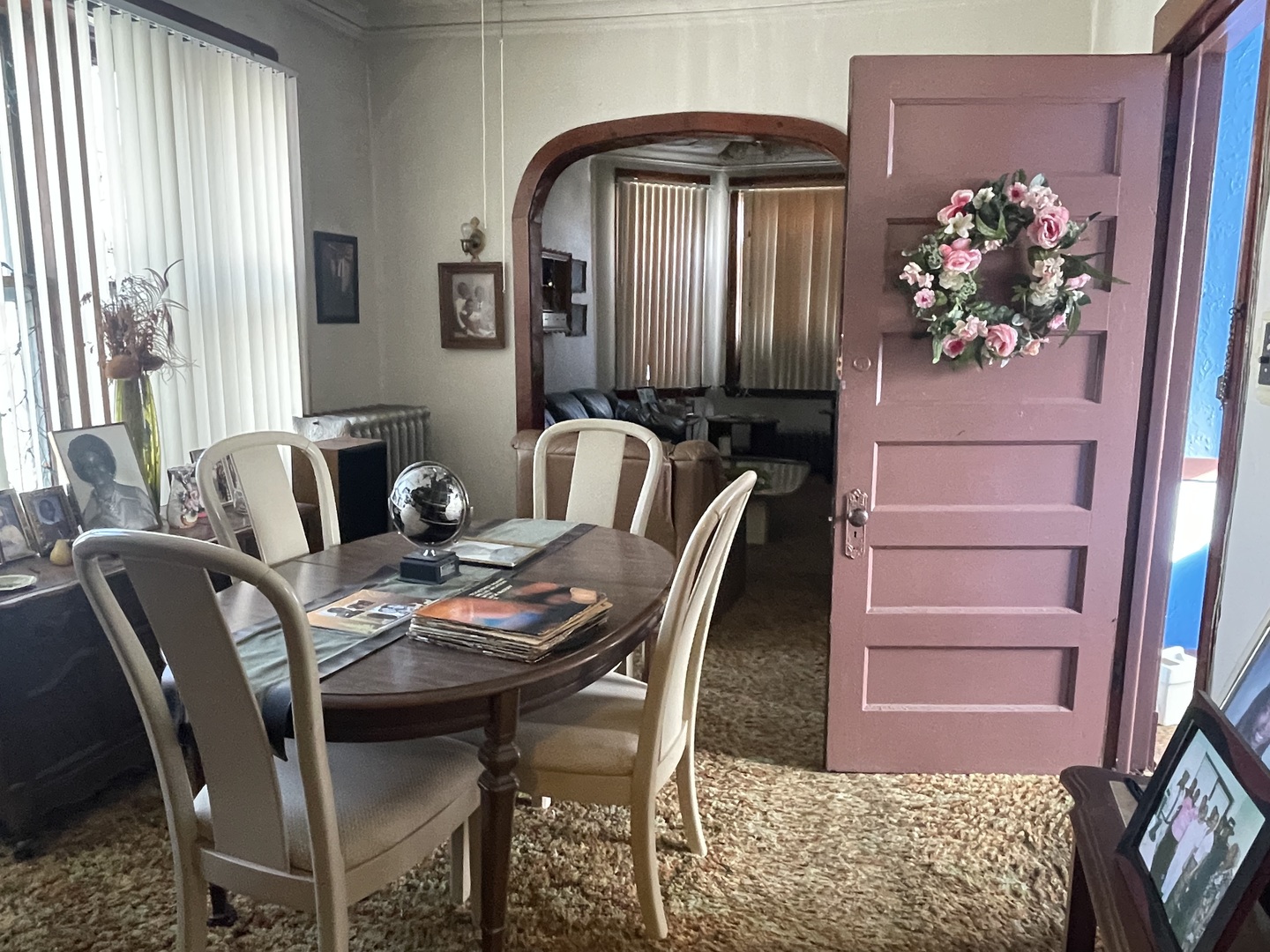 656 North Drake Avenue Chicago, IL 60624 - Photo 10 of 33 a dining room with furniture and flower vase