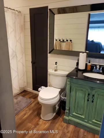 a bathroom with a toilet and a sink