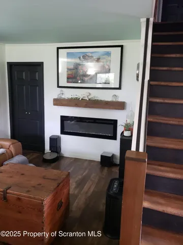 a bedroom with furniture and a fireplace