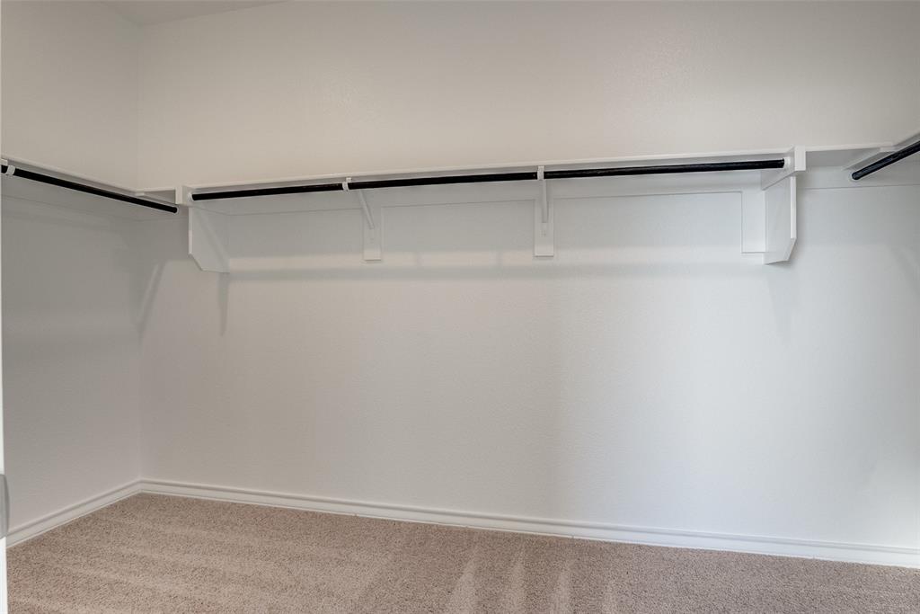 329 Fallbrook Drive Aledo, TX 76008 - Photo 16 of 33 a view of an empty walk in closet