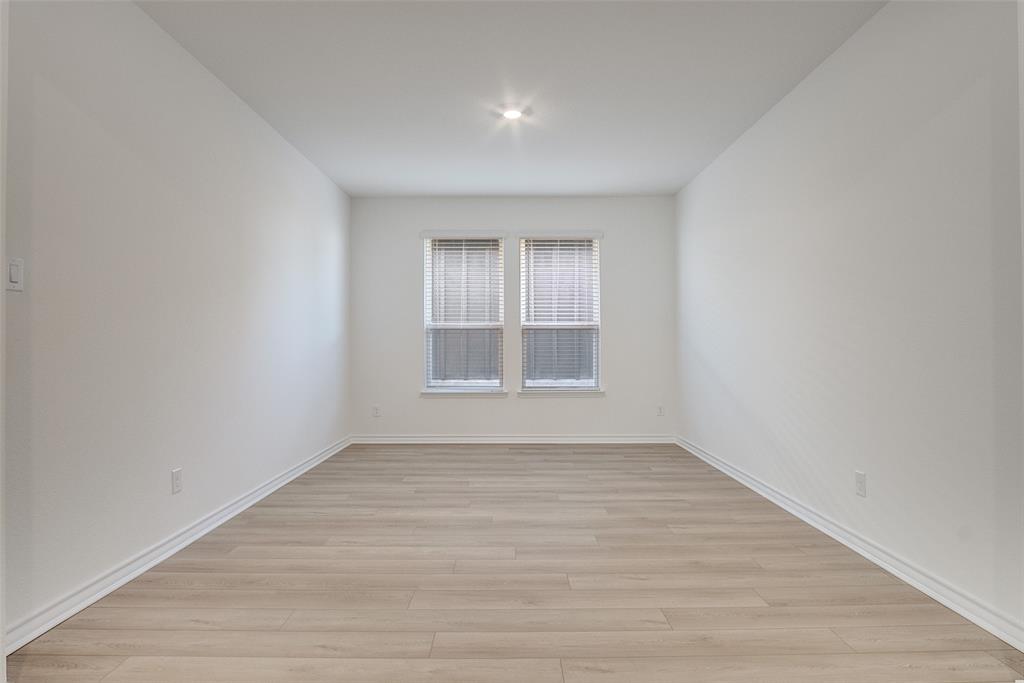 329 Fallbrook Drive Aledo, TX 76008 - Photo 3 of 33 wooden floor in an empty room with a window
