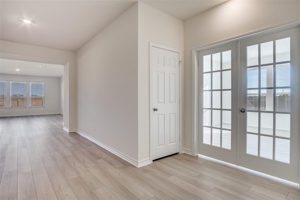 329 Fallbrook Drive Aledo, TX 76008 - Photo 5 of 33 wooden floor in an empty room with a window