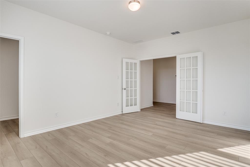 329 Fallbrook Drive Aledo, TX 76008 - Photo 6 of 33 a view of an empty room with wooden floor